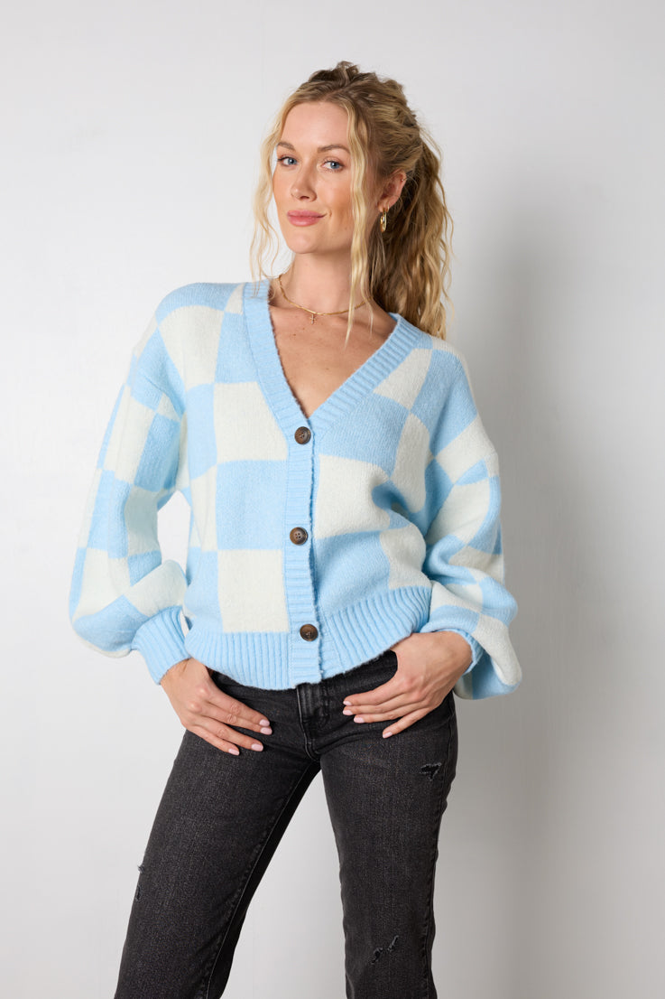 Dai un'occhiata al suo cardigan