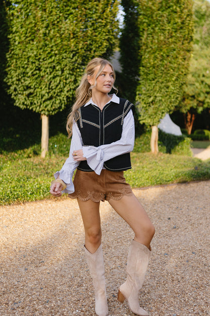 Gilet con i piedi per terra