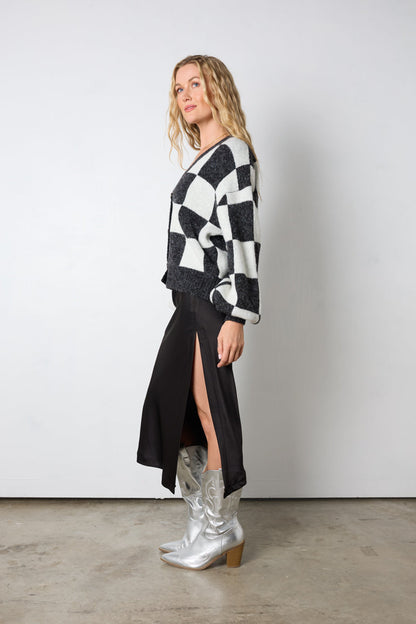 Dai un'occhiata al suo cardigan