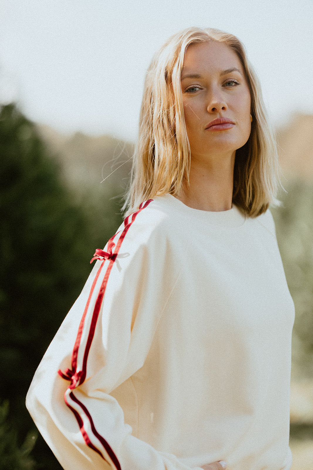 Felpa con scritta "Good Tidings"