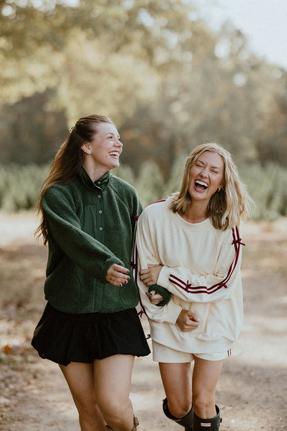 Felpa con scritta "Good Tidings"