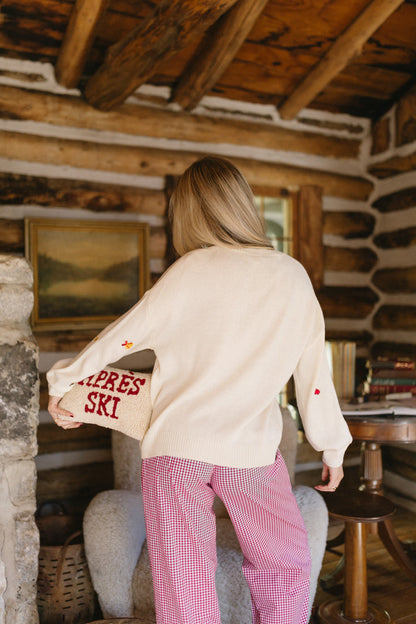 Maglione con ciondoli natalizi